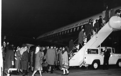 Members of the Eastman Philharmonia boarding their chartered plane at Idlewild Airport to begin their three-month tour. Photos by Louis Ouzer.