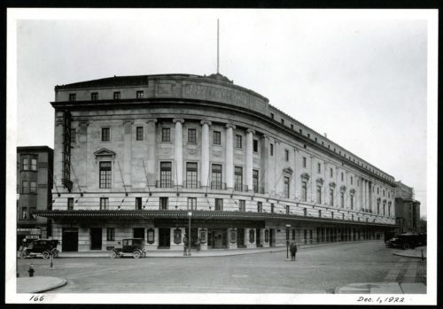 Black and white photo of the exterior of Eastman Theatre, viewed from the northwest corner of Main Street and Gibbs Street (1922).