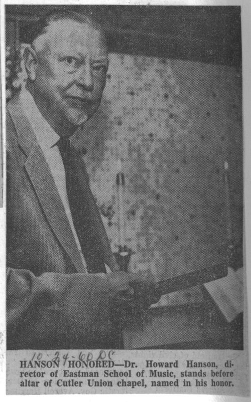 A press photo of Howard Hanson standing by the chapel altar. Preserved in Rochester Scrapbook September/November, 1960, Sibley Music Library.