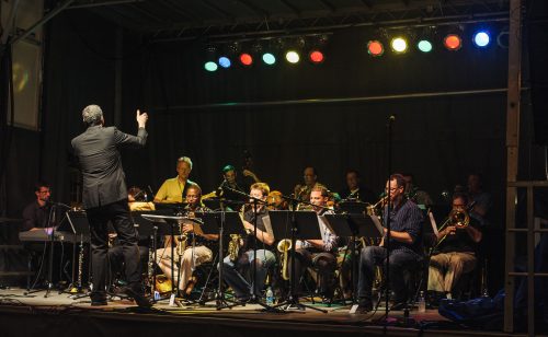 Bill Tiberio leading his band on stage at a Jazz Fest performance in 2014.