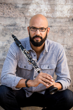 Alexander Laing, President and Artistic Director of Gateways Music Festival. Laing holds a clarinet. Photo by Jared Platt.