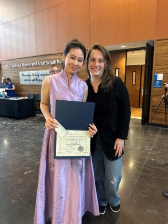 Pictured: L to R: Yunxin (Dorothy) Nie with Eastman Graduate Katherine Suzanne Weber '14E.